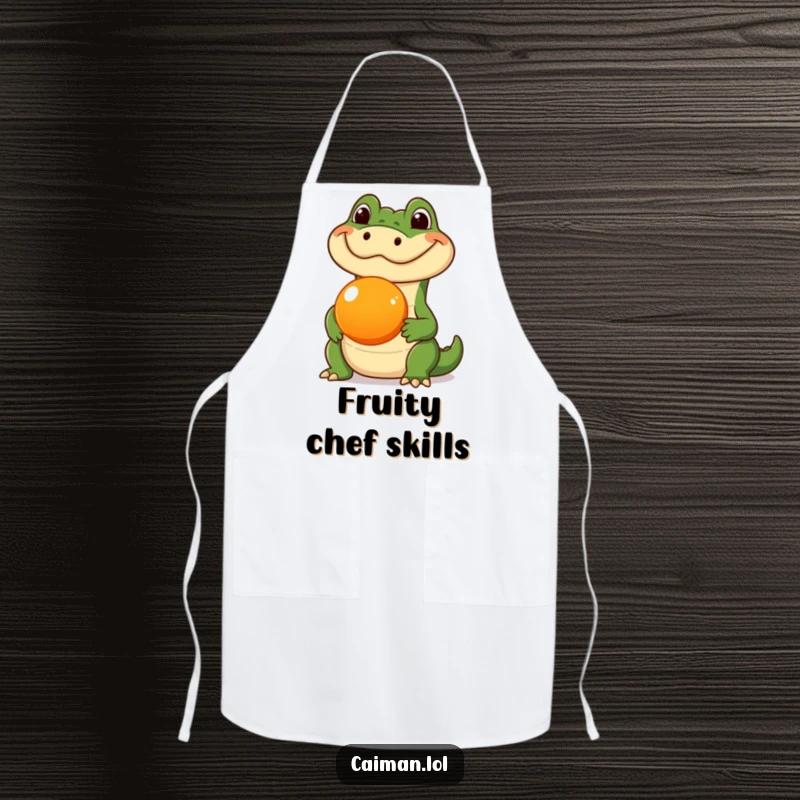 Funny Caiman Apron, a humorous kitchen garment featuring a caiman balancing a round orange fruit on its snout, bringing fun to cooking.