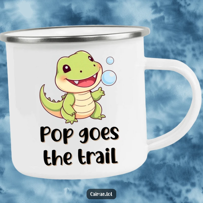 Funny camping mug showing a cheerful, toothy reptile with a stubby tail playfully snapping at a tiny floating bubble, perfect for nature lovers.