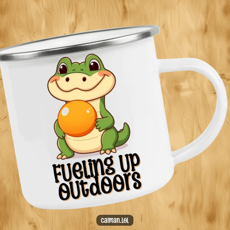 Funny Caiman Camping Mug, a durable outdoor mug featuring a caiman balancing a round orange fruit on its snout, blending adventure and humor.