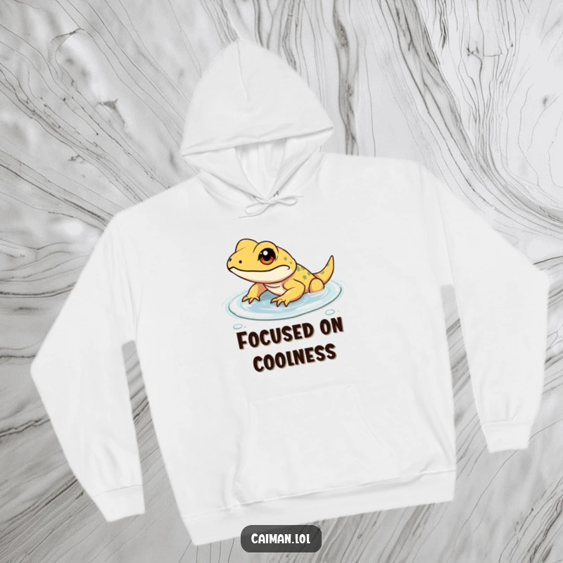 Funny hoodie illustrated with a determined, small reptile with a focused gleam in its eye, wading through shallow, clear water, symbolizing resilience.