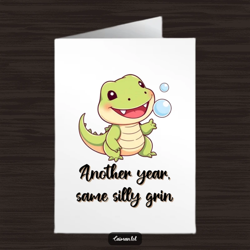 Funny Free Printable Birthday Card: A cheerful, toothed reptile with a stubby tail playfully snapping at a tiny floating bubble.