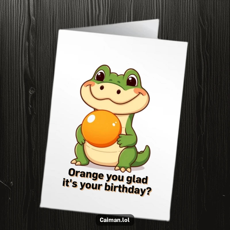 Funny Free Printable Birthday Card: Silly caiman balancing an orange fruit on its snout, great DIY humor.