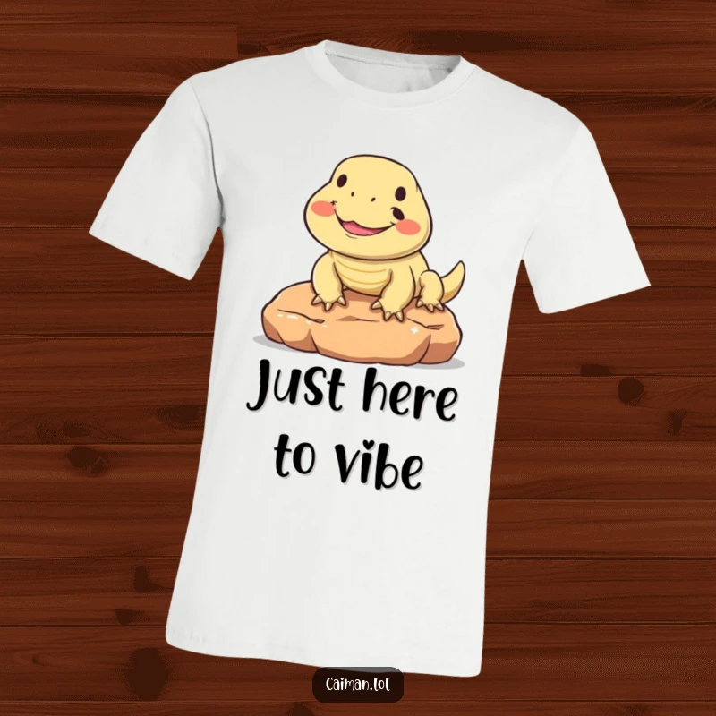 Funny t-shirt with a round, friendly reptile joyfully smiling while sunning on a warm stone, capturing a moment of pure reptilian bliss.