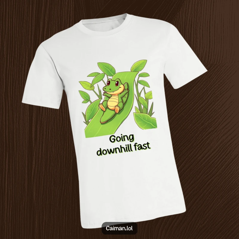 Funny Caiman T-Shirt: A hilarious caiman playfully sliding down a lush, green leafy slide with pure joy.