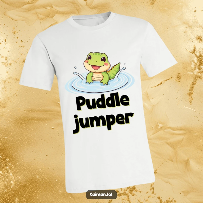 Funny T-Shirt featuring a small, cute reptile with a wide, happy grin splashing in a gentle, rippling puddle, exuding pure joy.